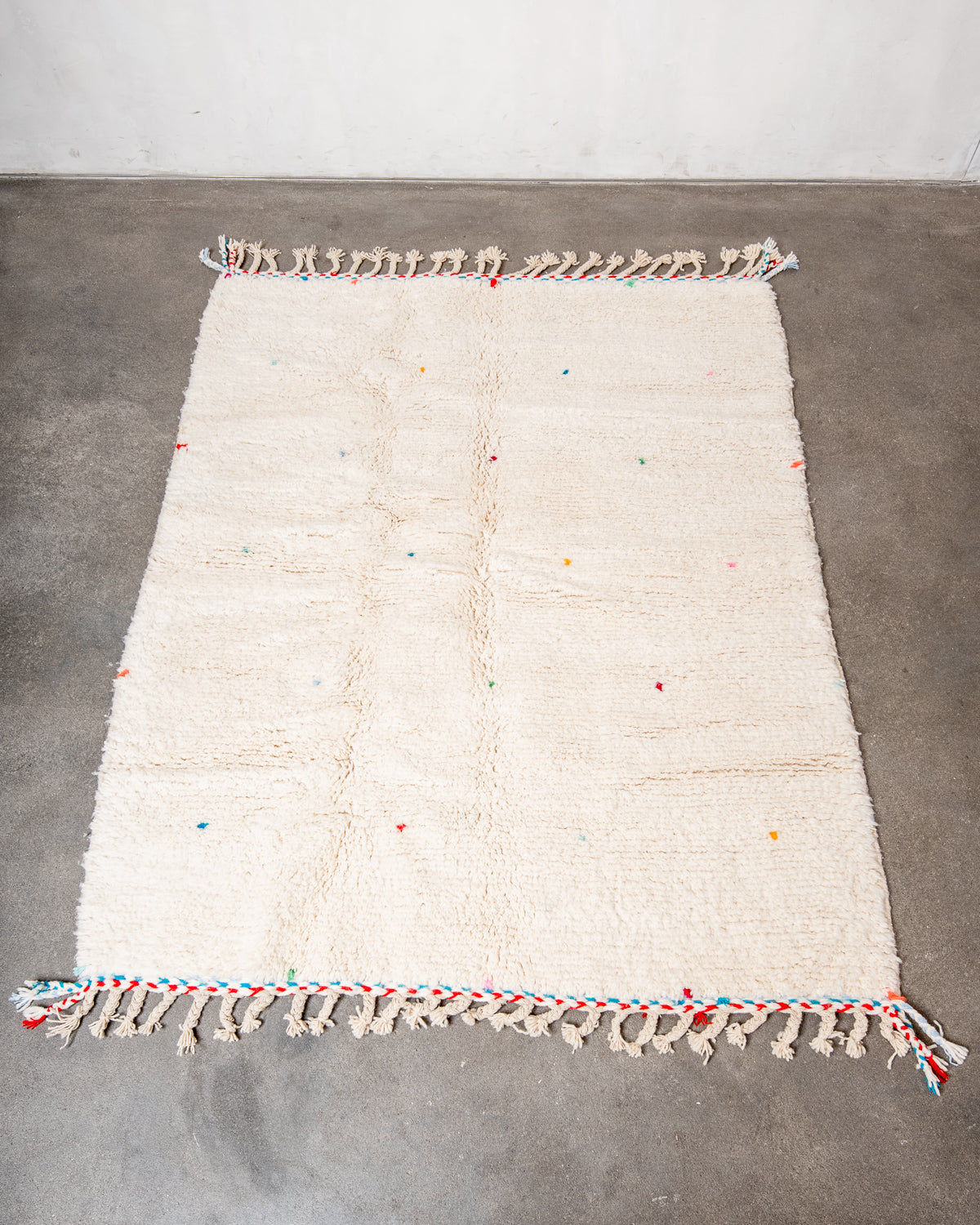 Modern, designer, handcrafted Berber rug from Morocco. Beniourain carpet with beautiful colours and patterns and fluffy wool texture.